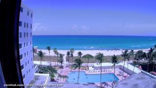 Naked on Miami beach, hotel room window on the ocean